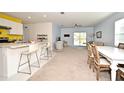 Open concept kitchen, living, and dining area at 1239 Berry Ln, Davenport, FL 33837