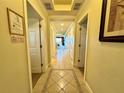 Hallway with tile flooring and multiple entryways to other rooms in the residence at 1350 Centre Court Ridge Dr # 401, Reunion, FL 34747