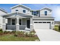Charming two-story home with stone accents, covered porch, and a two-car garage providing curb appeal at 1509 August Gray Dr, Kissimmee, FL 34744
