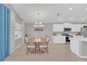 Bright dining room features a spacious table with seating for six at 1944 Harvest Landing Cir, Lakeland, FL 33810