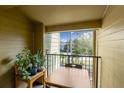 Relaxing patio featuring a table, chairs, and a view of the neighborhood at 2203 Key West Ct # 435, Kissimmee, FL 34741