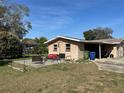 Large backyard with patio, fire pit, and plenty of space for entertaining at 780 Avenue H Ne, Winter Haven, FL 33881