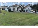 One-story house with a well-maintained lawn at 813 Halifax Dr, Kissimmee, FL 34758