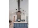 Bright kitchen with a large island, modern lighting, and a stylish range hood at 0 Orangewood Ave, St Cloud, FL 34772