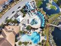 A beautiful aerial view of a luxurious pool and water park in a resort community at 113 Kenny Blvd, Haines City, FL 33844
