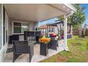 Inviting backyard patio featuring comfortable seating areas, a gazebo, and lush landscaping, perfect for outdoor relaxation at 13008 Baltimore Woods Ln, Orlando, FL 32824