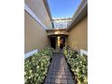A welcoming entryway with neatly landscaped shrubs leads to dual front doors at 14257 Desert Haven St # Ge, Windermere, FL 34786