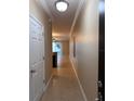 Bright hallway featuring tile flooring that flows into an open-concept living area at 14257 Desert Haven St # Ge, Windermere, FL 34786