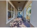 Spacious covered front porch with stylish lighting and a view of the neighborhood at 14637 Tanja King Blvd, Orlando, FL 32828