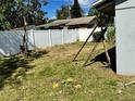 Fenced yard with some debris at 608 S Lakeview Ave, Winter Garden, FL 34787