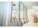 Dining room featuring pendant lighting and mirrored wall decor at 750 Pebble Beach Dr, Davenport, FL 33896