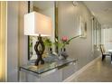 Contemporary entryway featuring an acrylic console table with glass top at 750 Pebble Beach Dr, Davenport, FL 33896