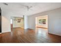 Bright living room boasting beautiful hardwood floors and fresh, neutral paint at 900 Delaware Ave, St Cloud, FL 34769