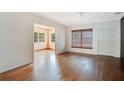 Cozy living room with hardwood flooring and a view into the next room at 900 Delaware Ave, St Cloud, FL 34769