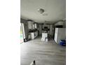 Open kitchen featuring an island and stainless steel appliances at 920 Gillingham Ct, Kissimmee, FL 34758