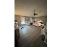 Bright main bedroom featuring a ceiling fan at 920 Gillingham Ct, Kissimmee, FL 34758