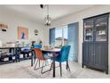 Dining room with table, hutch, and blue accent chairs at 1755 Buckeye Rd, Davenport, FL 33837