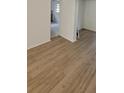 Spacious living room with stylish wood-look flooring and an open layout at 332 Carolina Ave, St Cloud, FL 34769