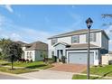 Attractive two-story home with a two-car garage and landscaped front yard at 580 Seattle Slew Dr, Davenport, FL 33837