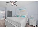 Bright bedroom with a king-size bed, stylish decor, and ample natural light at 7671 Comrow St # 303, Kissimmee, FL 34747