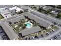 Aerial view of the community showcasing buildings, parking, and a central pool at 777 W Lancaster Rd # A-13, Orlando, FL 32809