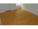 Bedroom featuring light colored wood-style flooring, base molding, and a closet at 84 Silver Park Cir, Kissimmee, FL 34743