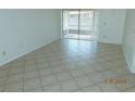 Spacious living room with tile flooring and sliding glass doors to the exterior at 84 Silver Park Cir, Kissimmee, FL 34743