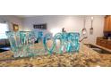 Decorative welcome sign on a granite countertop, adding charm to the home's interior at 8961 California Palm Rd, Kissimmee, FL 34747