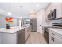 Modern kitchen featuring stainless steel appliances, a kitchen island and sleek finishes at 12691 Sw 33Rd Ave, Ocala, FL 34473