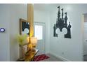 Bright entryway featuring Disney themed wall art and a charming welcome console table at 1520 Oak Hill Trl, Kissimmee, FL 34747