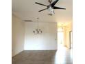 Open-concept living room features neutral walls and a modern ceiling fan at 2523 Salzburg Loop, Winter Haven, FL 33884