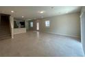 Open floor plan boasts modern tile flooring at 2595 Buena View Road, Kissimmee, FL 34746