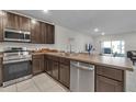 Well-equipped kitchen with stainless steel appliances and spacious countertops at 4846 Coral Castle Dr, Kissimmee, FL 34746