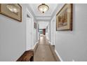 Inviting hallway with neutral walls, tile flooring, and recessed lighting at 7652 Whisper Way # 401, Reunion, FL 34747