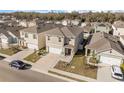 Aerial view of a modern residential neighborhood with well-maintained lawns and uniform two-story homes at 1368 Berry Ln, Davenport, FL 33837