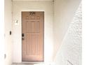 Close-up of the front door, showcasing the unit number '226' and the charming 'Villa Betty Boo' nameplate at 226 Bailey Cir, Davenport, FL 33897