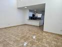 Bright living room featuring open concept and tile flooring that connects to an open kitchen at 2464 Harbour Way, Winter Park, FL 32792