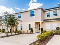 Charming townhome with a well-manicured front yard and spacious driveway at 4823 Coral Castle Dr, Kissimmee, FL 34746