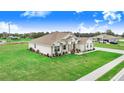 Lovely single-story home featuring a well-maintained lawn and landscaping at 944 Lochland Loop, Bartow, FL 33830