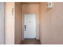 A white front door with the number 204, inviting entry to this lovely condo unit at 13829 Timberland Dr # 204, Orlando, FL 32824