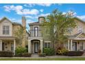 Charming two-story home with a balcony, manicured landscaping, and a welcoming front entrance at 1545 Indiana Ave # B, Winter Park, FL 32789