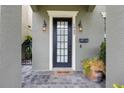 Close up view of the front entrance door to home #1545 showing a 'Welcome' mat at 1545 Indiana Ave # B, Winter Park, FL 32789