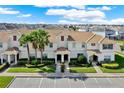 Lovely condo exterior with a tile roof, neat landscaping, and ample parking at 1554 Plunker Dr, Davenport, FL 33896