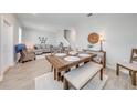 Well-lit dining area featuring a wooden table, bench, and chairs with stylish decor at 1860 Tohoqua Blvd, Kissimmee, FL 34744