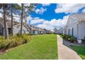 Charming neighborhood homes with blue shutters and well-maintained lawns, creating a welcoming community at 2022 Island Walk Dr, Orlando, FL 32824