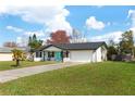 Well-maintained home with attached garage, neat landscaping, and a classic brick facade at 725 Montana Ave, St Cloud, FL 34769
