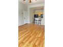 Bright living room featuring wood floors and eat-in kitchen with breakfast bar at 8927 Legacy Ct # 302, Kissimmee, FL 34747