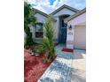 Inviting single-story home with landscaped walkway and arched entryway at 12634 Ringwood Ave, Orlando, FL 32837