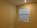 An adequately sized bedroom with neutral colors at 1892 Spring Shower Cir, Kissimmee, FL 34744