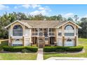 Beautiful condo with well-manicured lawn and garden, a welcoming entry to a desirable home at 2466 Sweetwater Club Cir # 4, Kissimmee, FL 34746